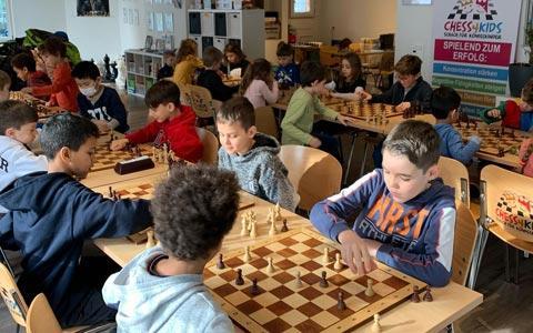 Children playing a chess tournament in our vacation camp