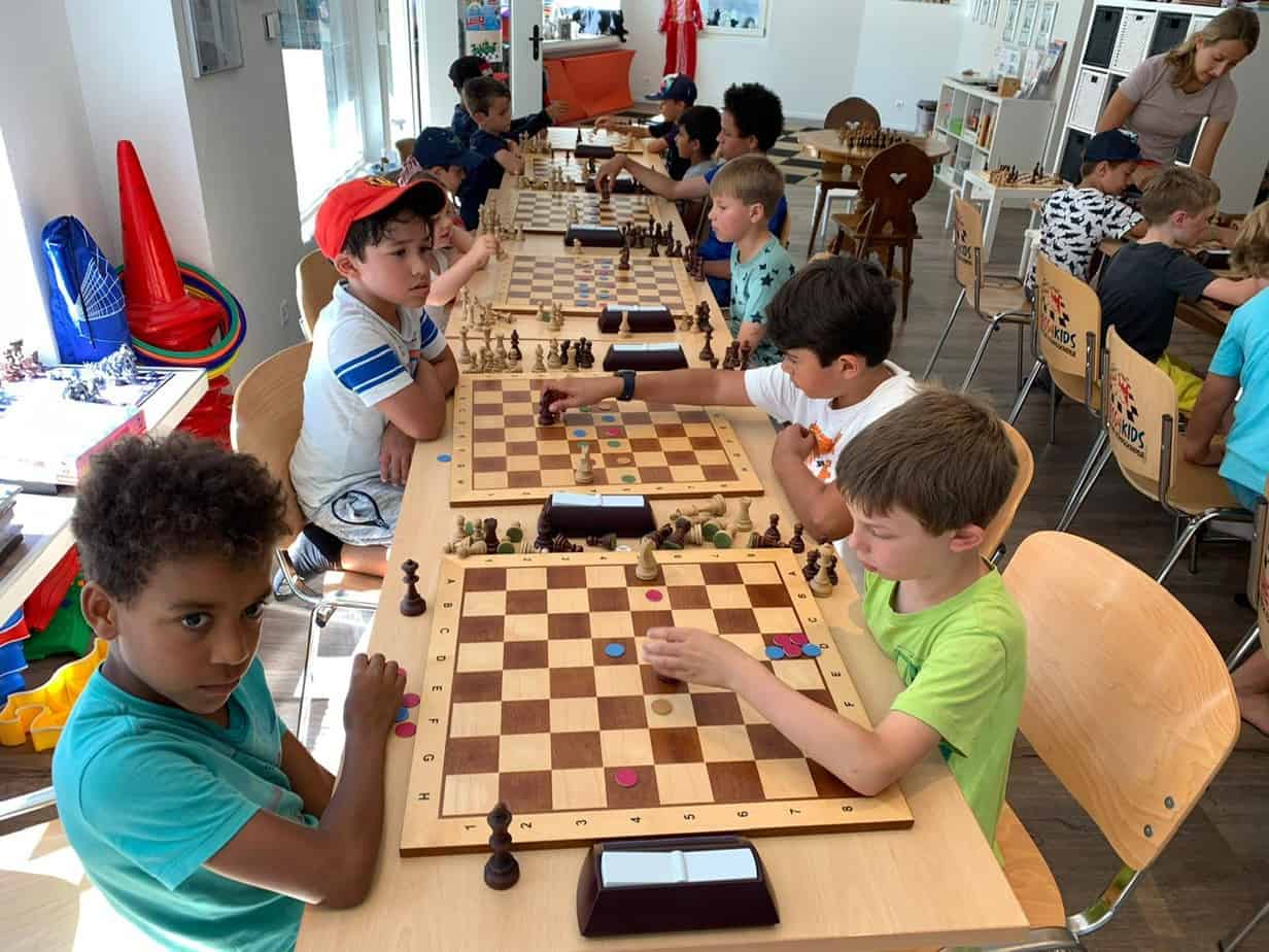 Children playing a chess tournament
