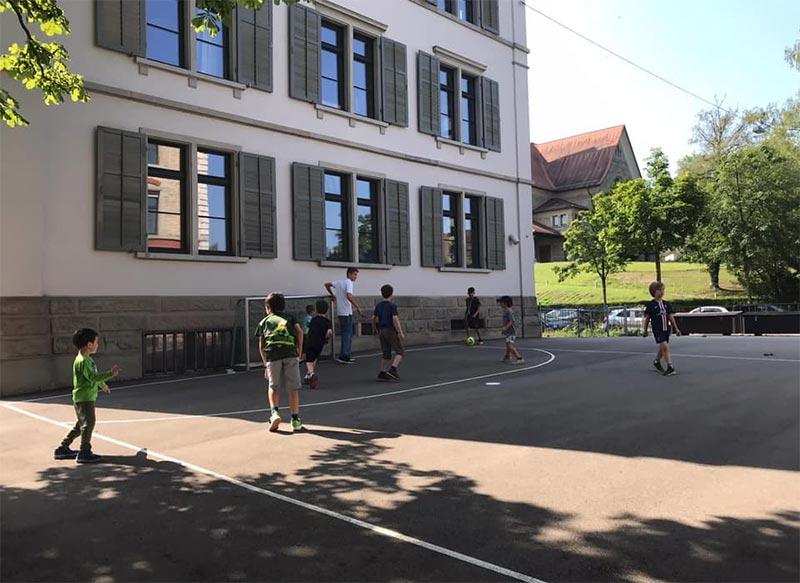 Children play soccer on the sports field